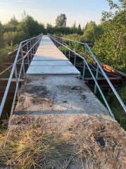 Андрей Забаев проверил качество работ по обустройству пешеходного моста через реку Лахость